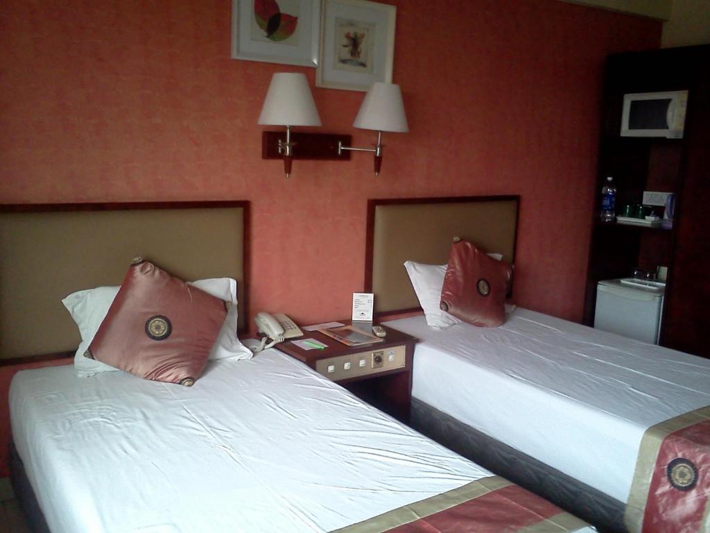Landmark Hotel Calcutta Værelse billede